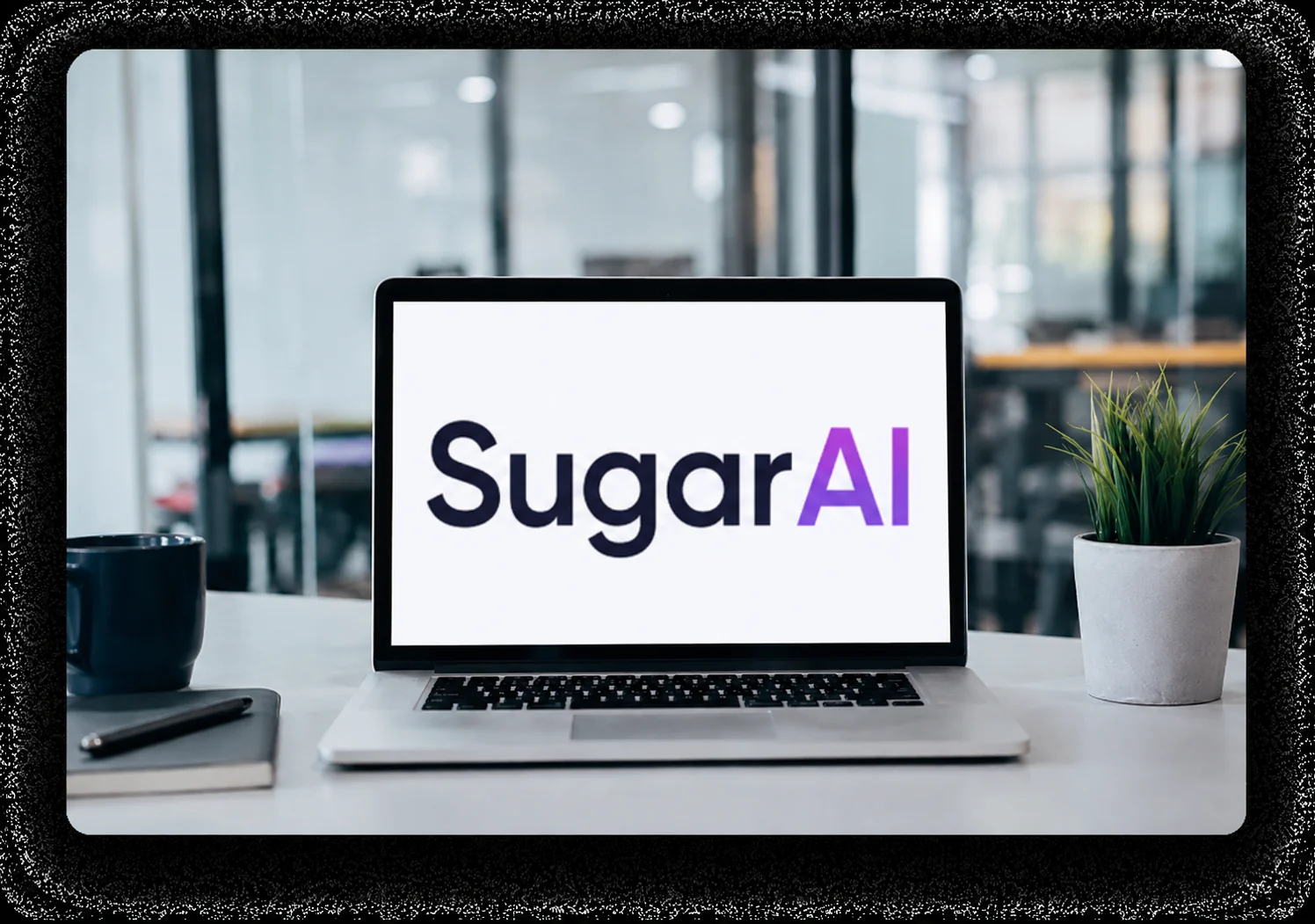 SugarAI CRM displayed on a laptop